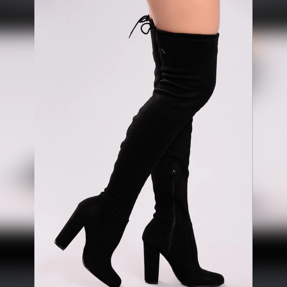 Black thigh high boots.